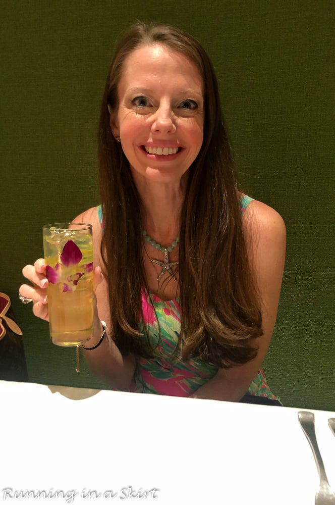 Woman holding drink at Cielo, one of the best restaurants in Sanibel