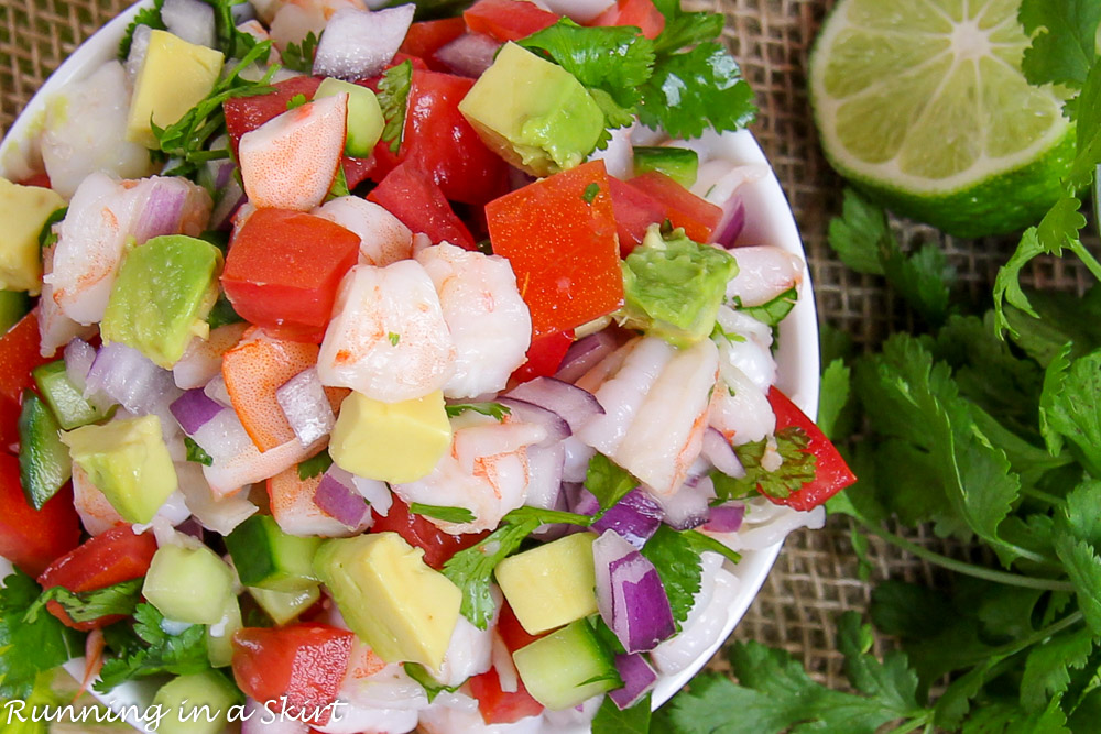 Overhead shop with shrimp, tomato, lime, avocado and onion