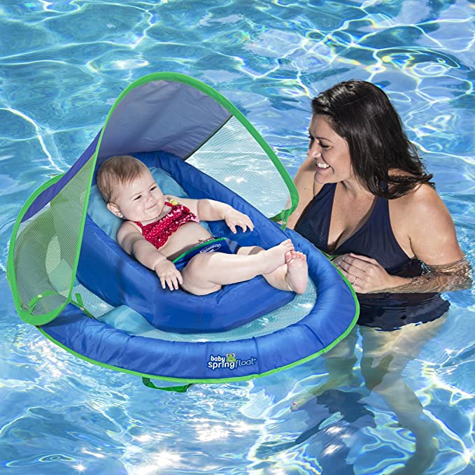 Mom holding baby in Infant Spring Float