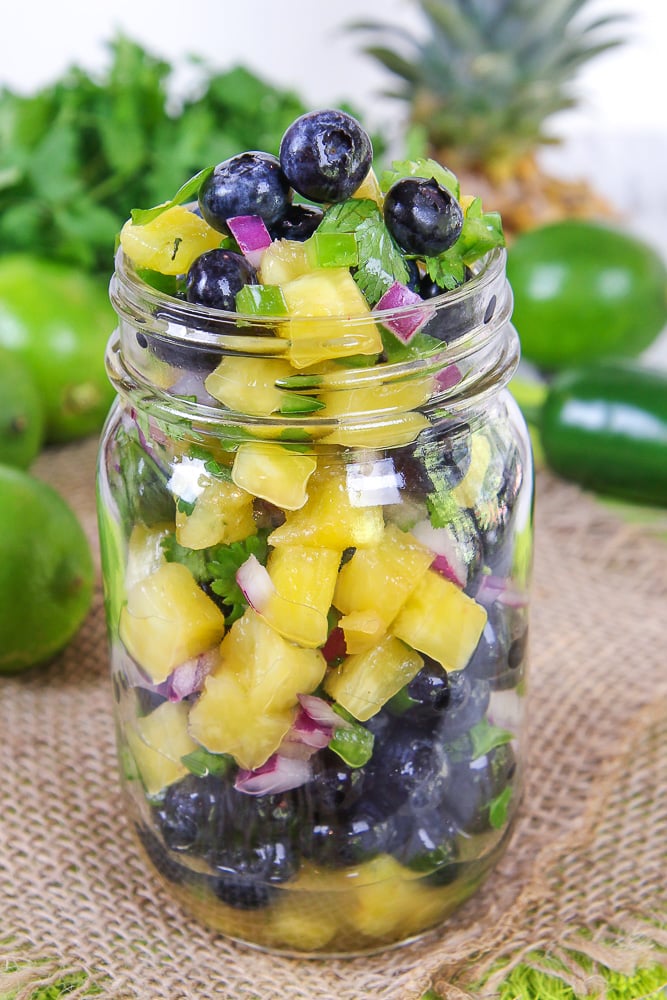 Easy Blueberry Salsa recipe with pineapple in a mason jar.