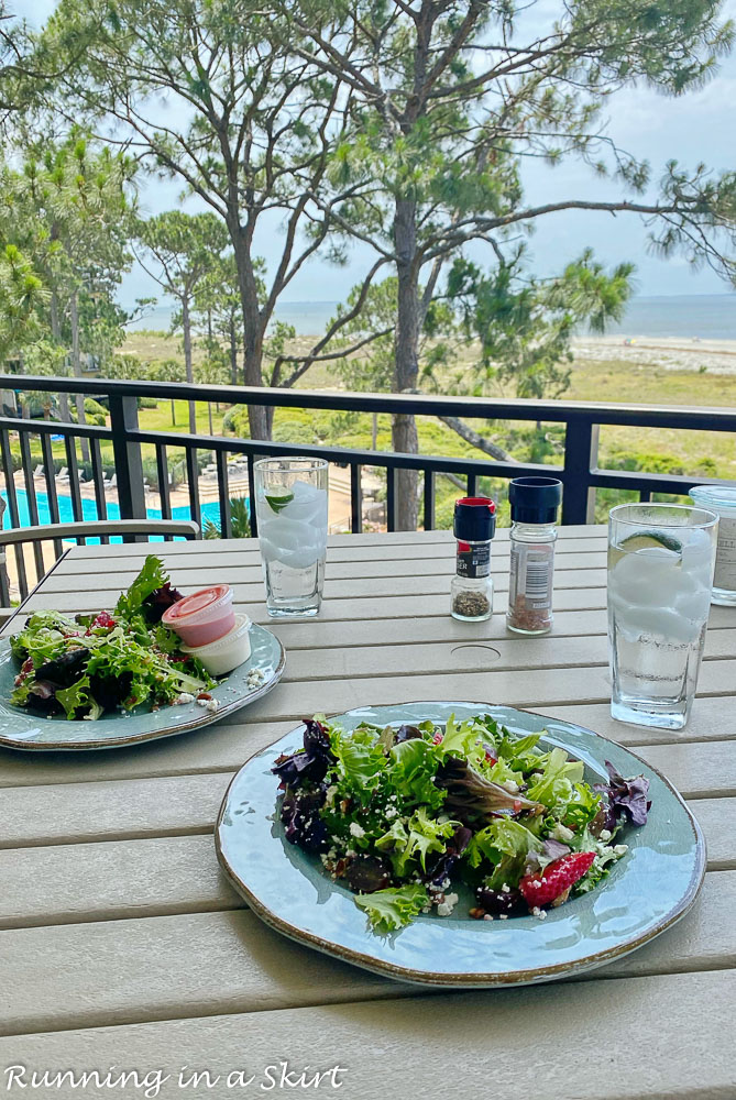 Plates on table overlooking ocean.