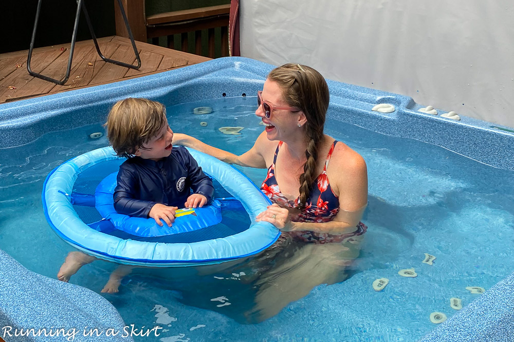 Mom in pool with toddler.