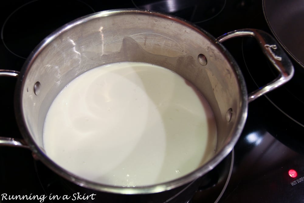 Pot with water and coconut milk to cook coconut rice.