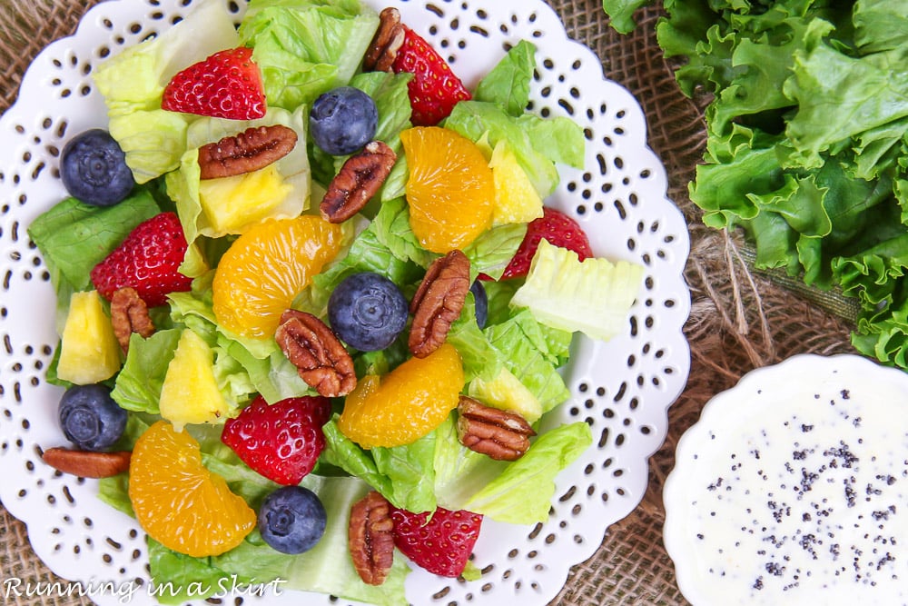 Overhead shot of Copycat Panera Strawberry Poppyseed Salad on a white plate.