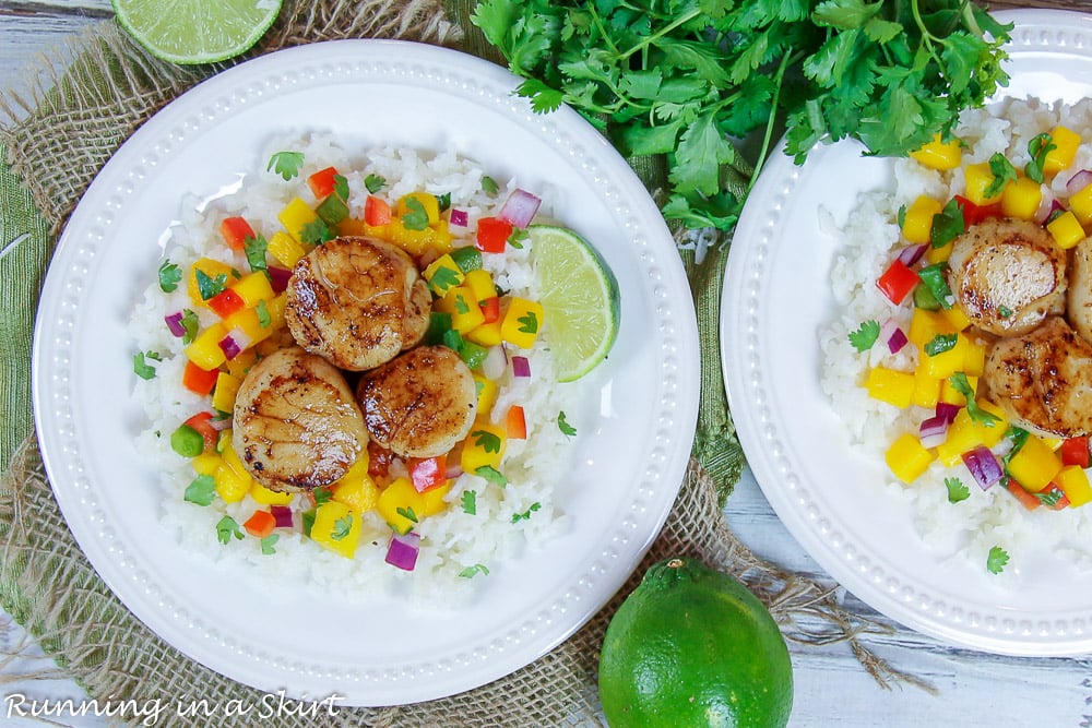 Finished product on plate of Seared Scallops with Mango Salsa on two white plates.