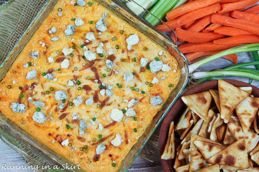 Buffalo Shrimp Dip with carrots, celery and pita chips.