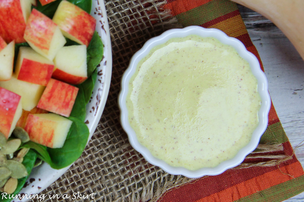 Close up of salad dressing in a white bowl.