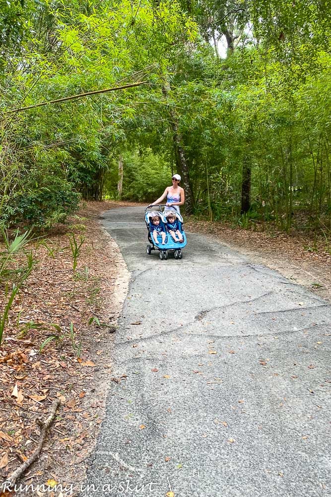 Mom pushing stroller on walking paths on Kiawah Island SC.