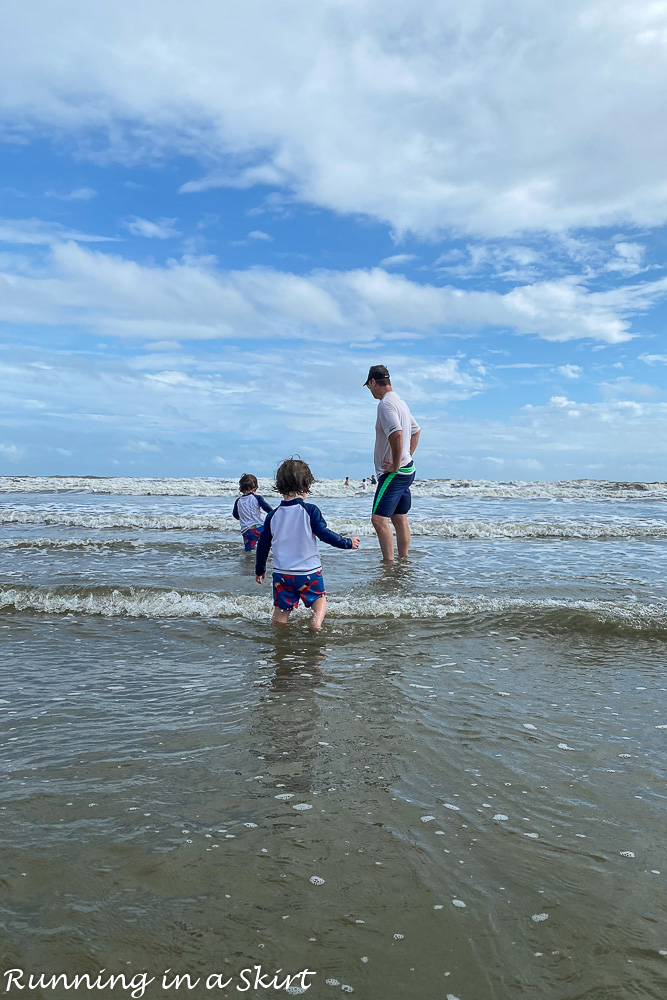 Dad with twins on the beach in Kiawah Island.