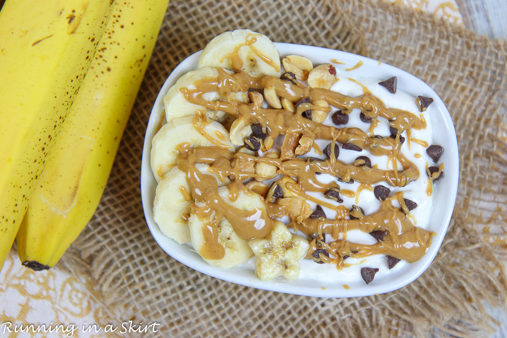 Chunky Monkey Greek Yogurt bowl on a napkin with a banana.