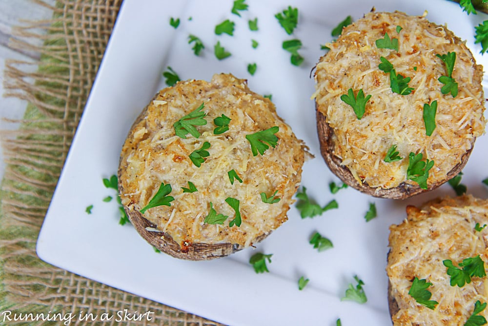 Healthy Crab Stuffed Portobello Mushrooms on a white plate.