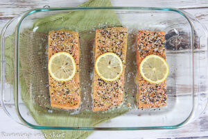 Salmon cooking in a baking pan.