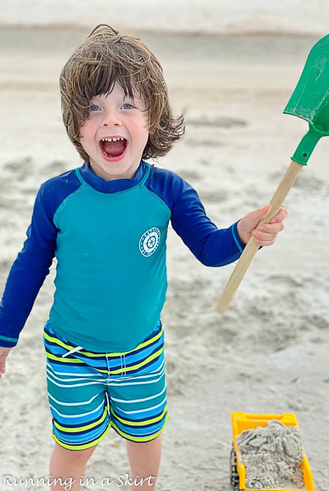 Kid smiling on Amelia Island Beach.