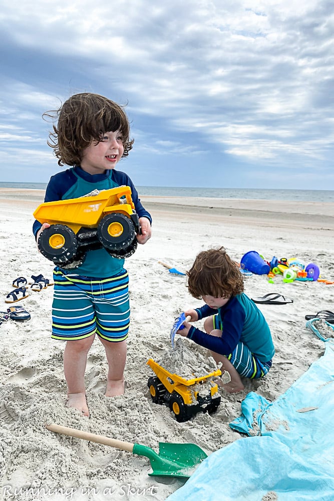 Kids playing with truck on Amelia Island beach.