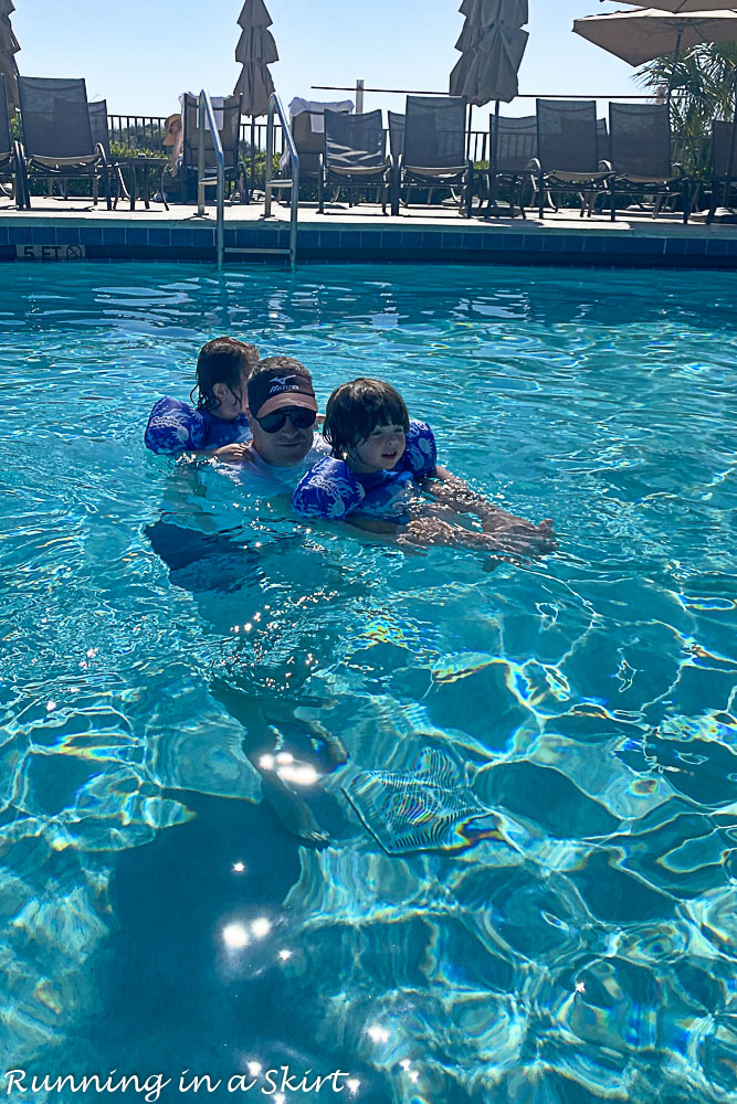 Family playing in Amelia Island pool.