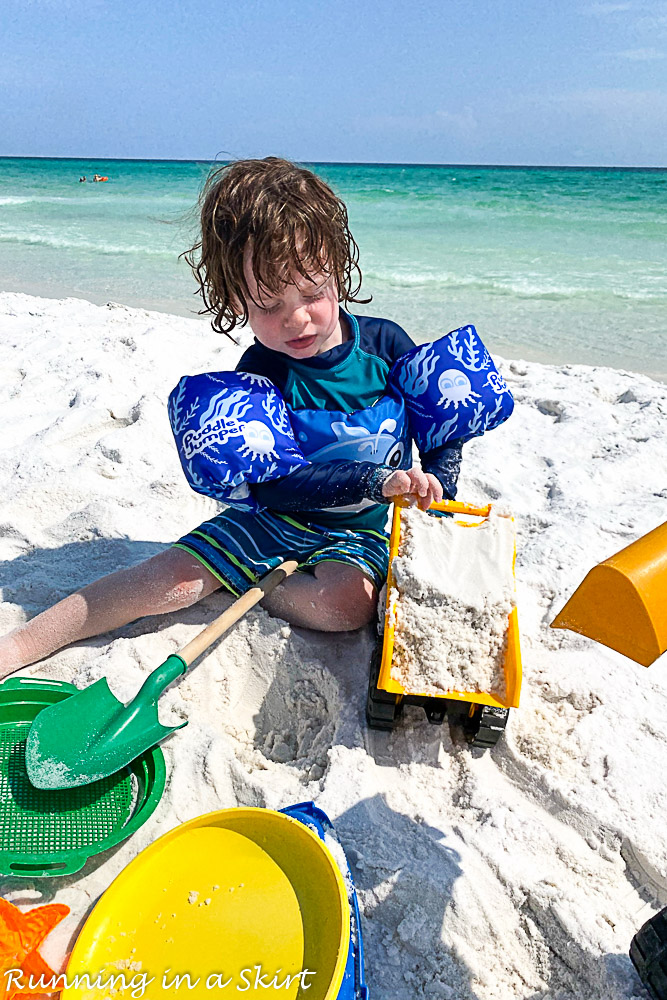 Destin Florida beaches with toddler playing with dumptruck.