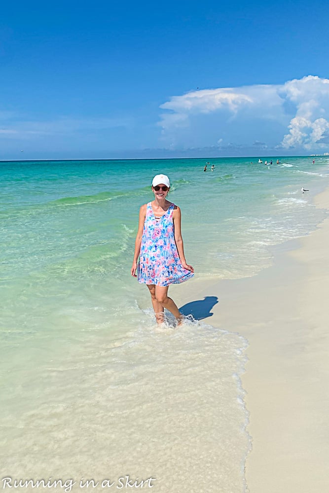 Destin Florida Travel Guide showing person in the water at the beach.