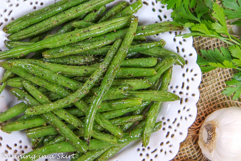 Roasted Green Beans with Garlic overhead shot on a white plate.