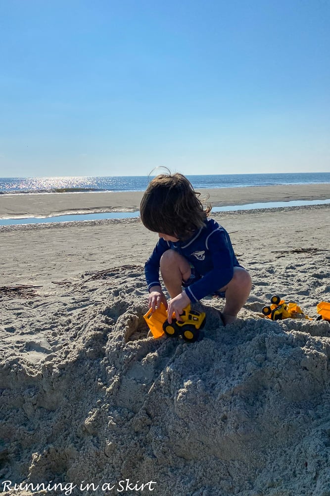 Boy playing in the sand.