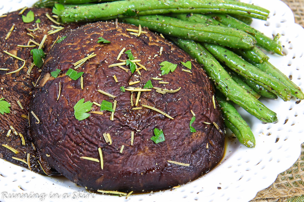Finished product of the Portobello Mushroom Steak on a white plate with green beans.