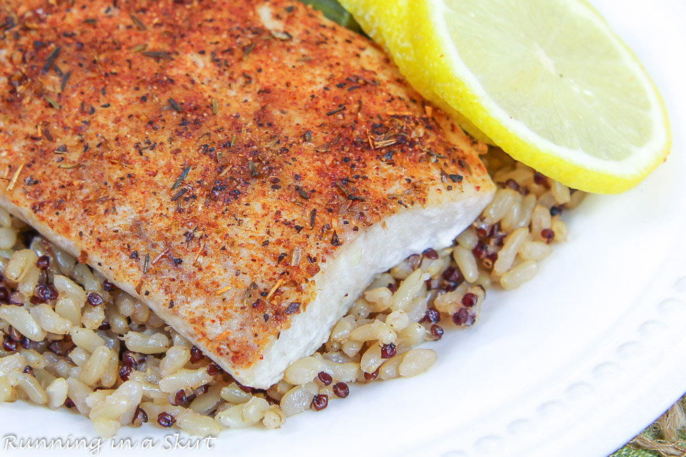 Blackened Mahi Mahi on a bed of rice with lemon.