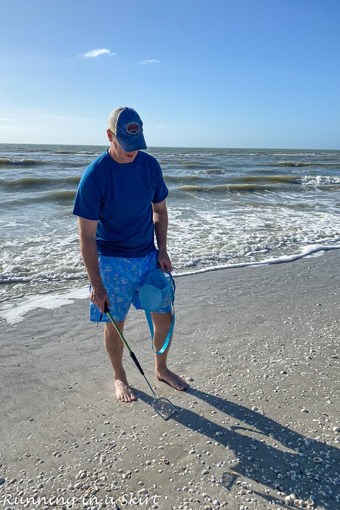 Man looking for shells.