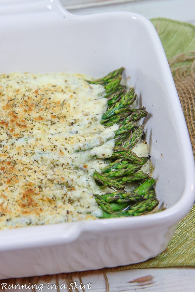 Cheesy Asparagus Casserole in a white baking dish.