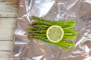 Process photo showing how to stack the asparagus in the foil.