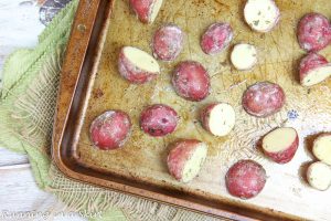 Process photo showing how to space the potatoes on the baking sheet.