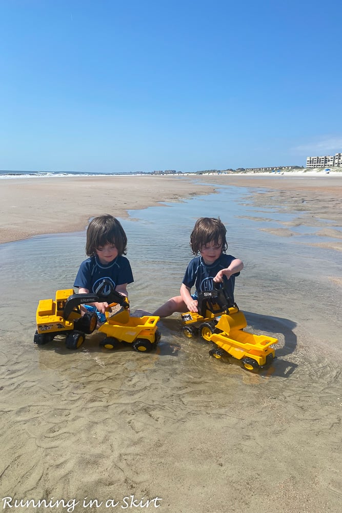 Toddler playing in tidepools on Amelia Island beach.