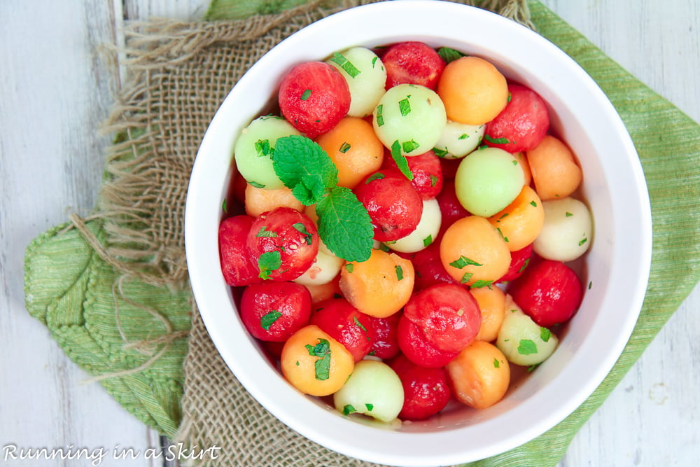 Melon Salad in a large serving bowl showing how to mix it up.