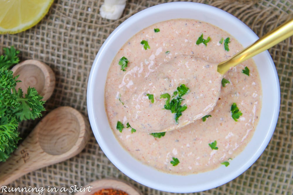 Close up of spoon stirring the Remoulade Sauce for Crab Cakes