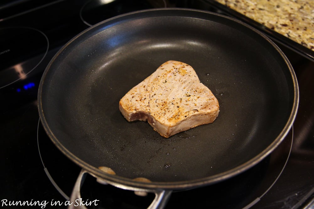 Photo showing the process of searing the tuna.