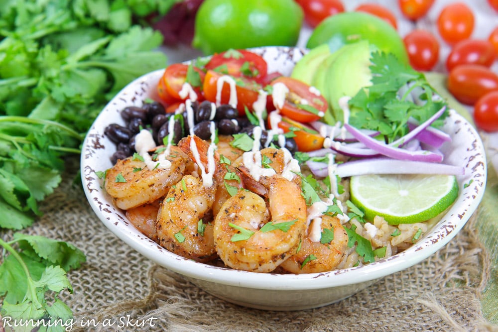 Shrimp Taco Bowls with tomatoes, black beans and lime.