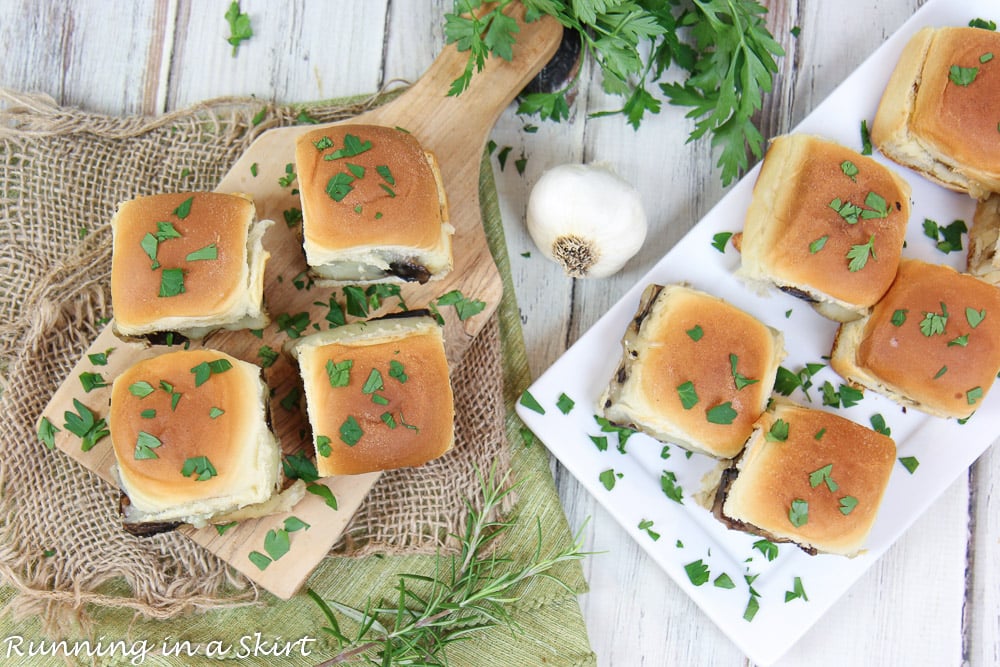 Vegetarian Sliders with Portobello Mushrooms and White Cheddar on a cutting board.