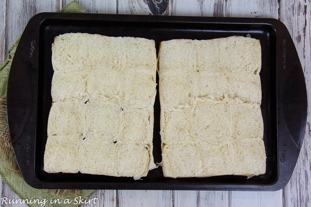 Process photo showing how to cut the Hawaiian Rolls in half.