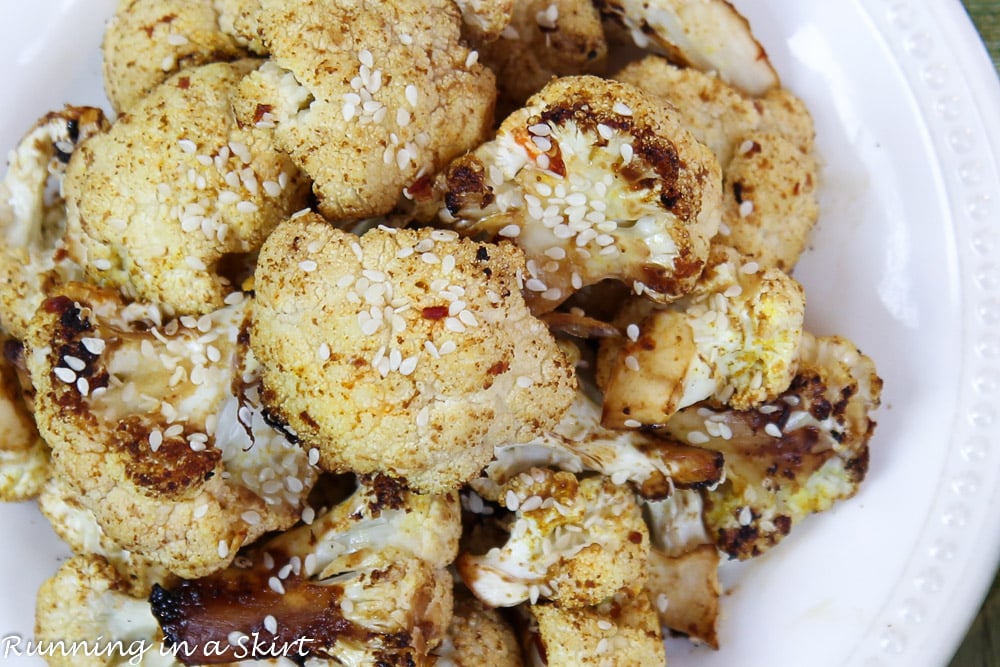 Roasted Asian Cauliflower close up on a white plate.