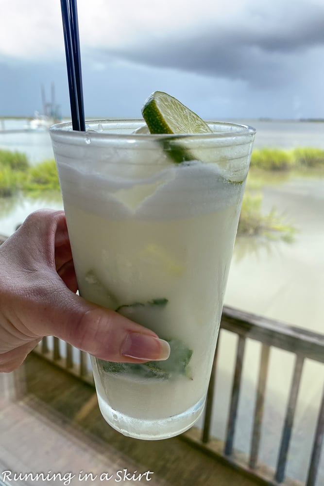 Jekyll Island Restaurants- Cocktail at The Wharf with a waterfront view.