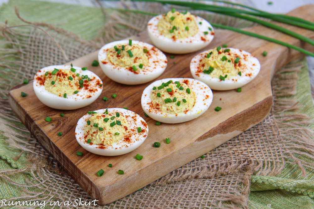 Greek Yogurt Deviled Eggs No Mayo on a cutting board.