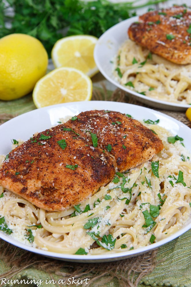 Blackened Salmon Alfredo Pasta recipe in a white bowl with a second portion behind it.