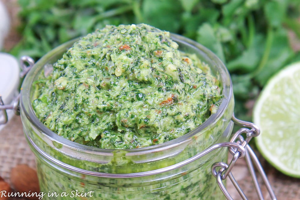 Cilantro Pesto recipe close up in a glass jar.