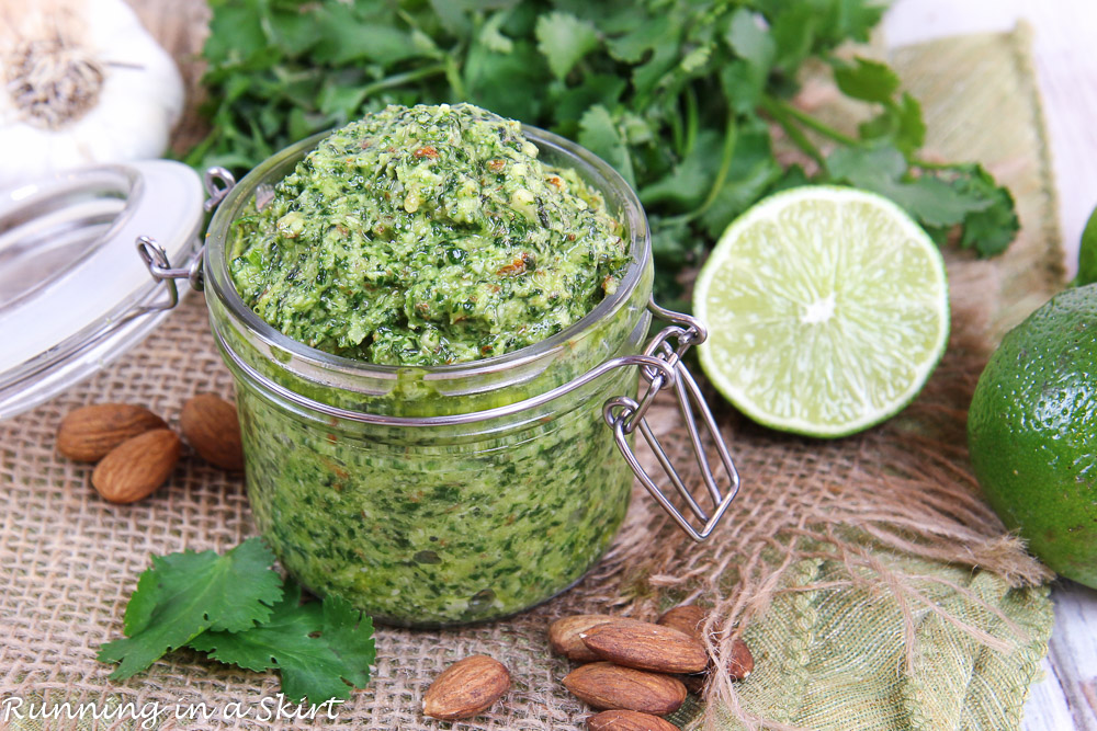 Cilantro Pesto recipe with cilantro and lime in the background.