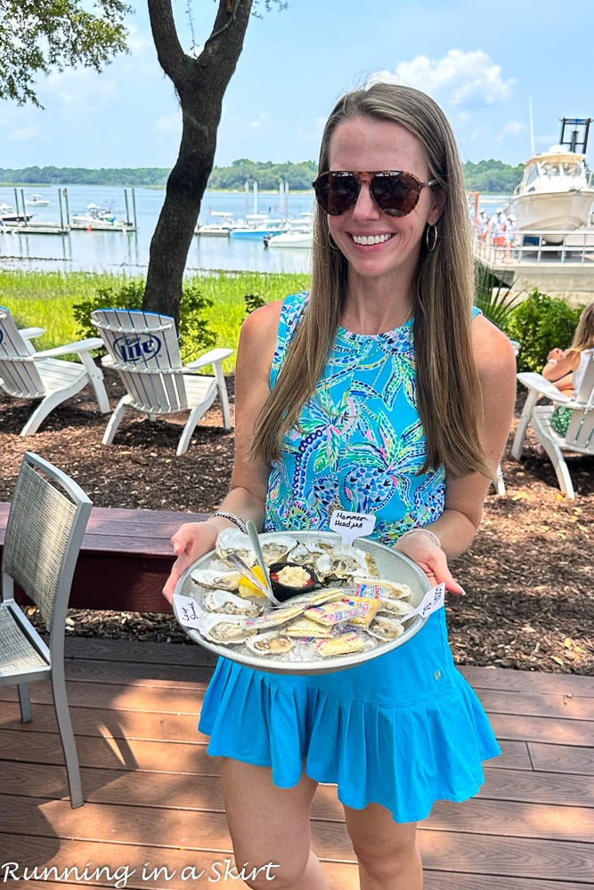 Pescatarian holding tray of oysters.