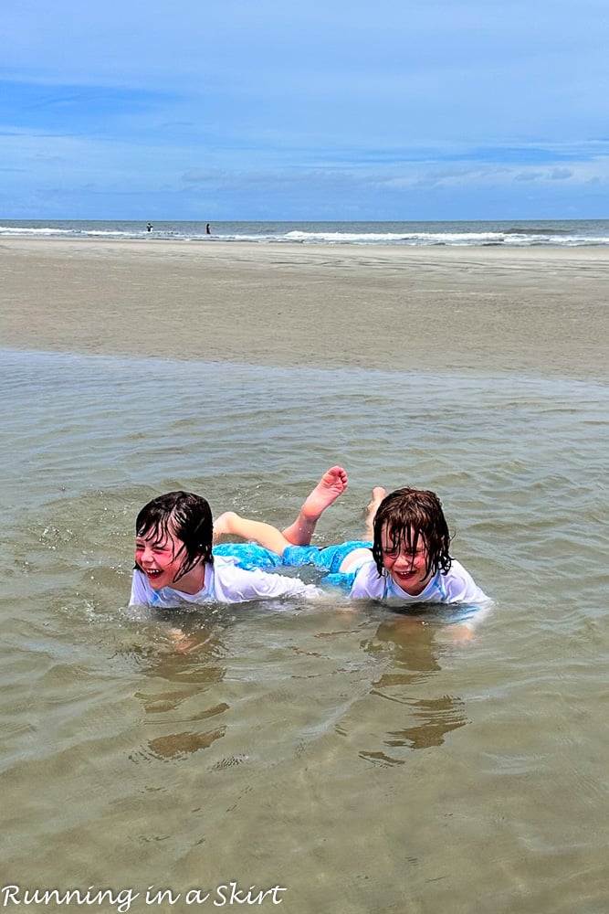 Kids playing in Hilton Head tidepool on the beach.