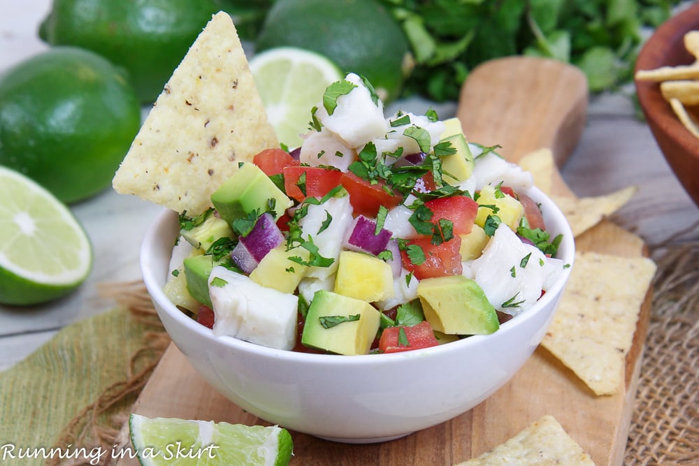 Halibut Ceviche in a white bowl with a chip.