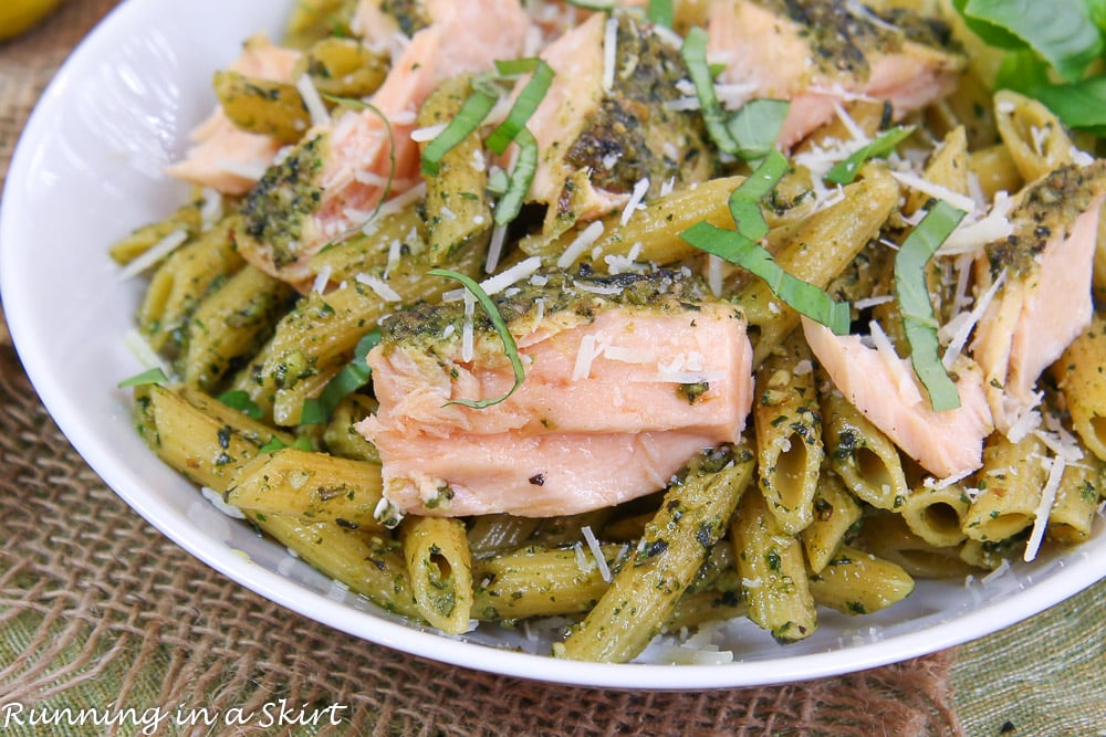 Close up of Salmon Pesto Pasta in a white bowl.