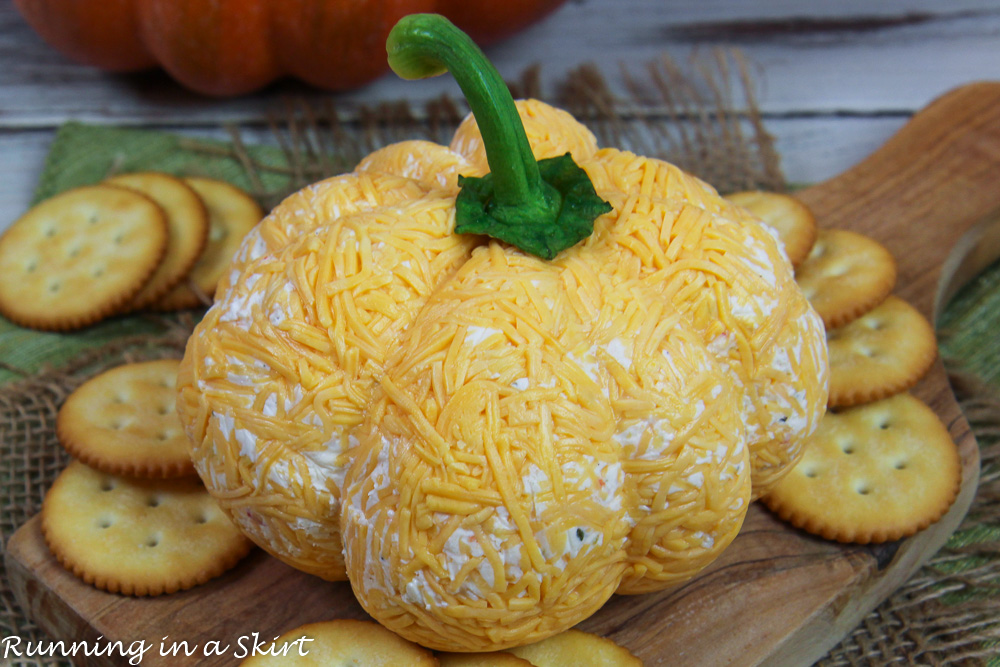Pumpkin Cheese Ball on a cutting board.