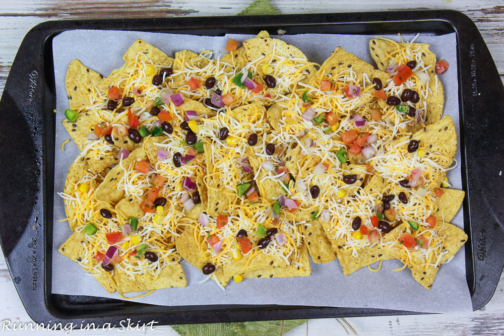 Process photo showing how to layer the nachos.