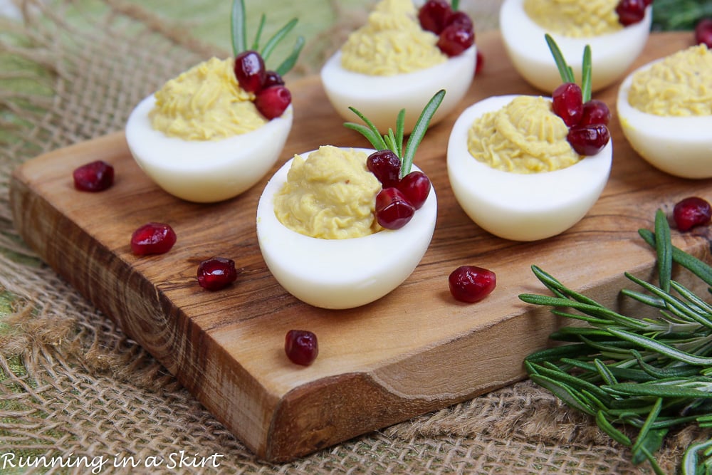 Christmas Deviled Eggs arranged on a board.