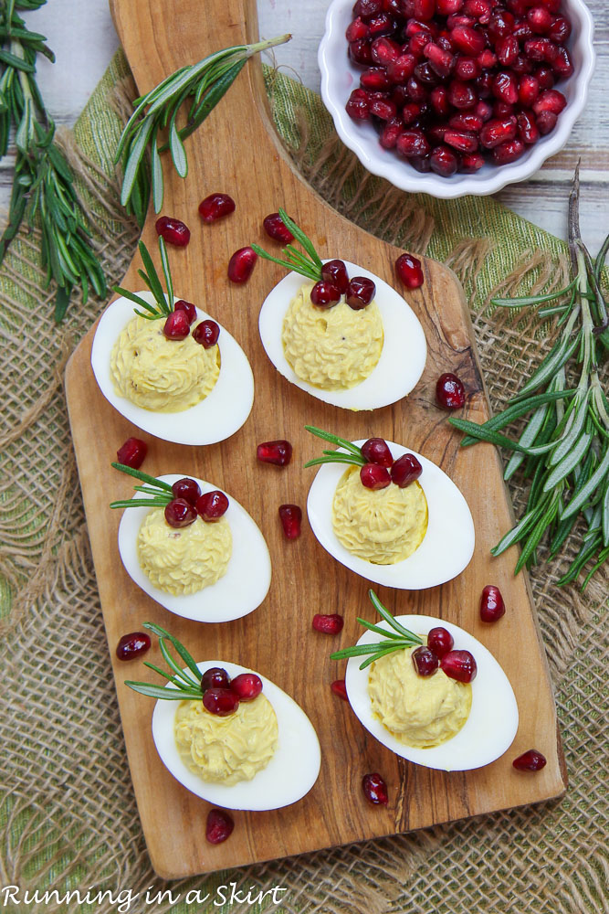 Christmas Deviled Eggs on a wooden board.